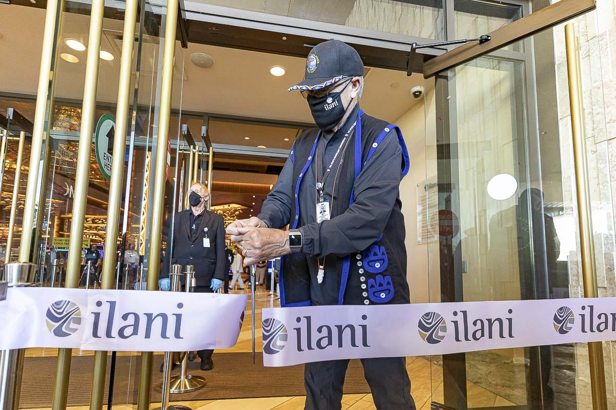 William Iyall, chairman of the Cowlitz Tribe, cuts a ribbon to reopen ilani. The center, which has gaming, restaurants, and shops, has been closed for 70 days. Photo by Mike Schultz
