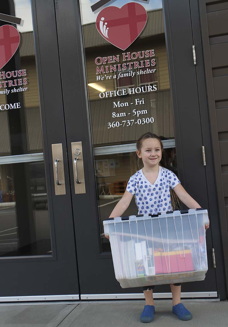 Frankie, an Artstra volunteer, delivers donated arts supplies to families at Open House’s family shelter. Photo courtesy of Open House Ministries