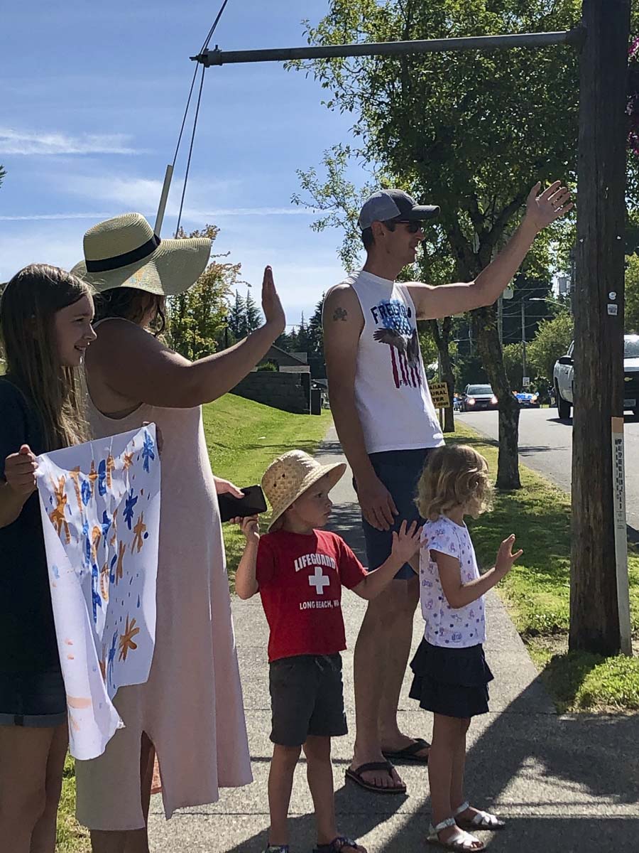 Families lining the parade route wave to Union Ridge Elementary teachers as they drive by during the school's end of year car parade. Photo courtesy of Ridgefield Public Schools