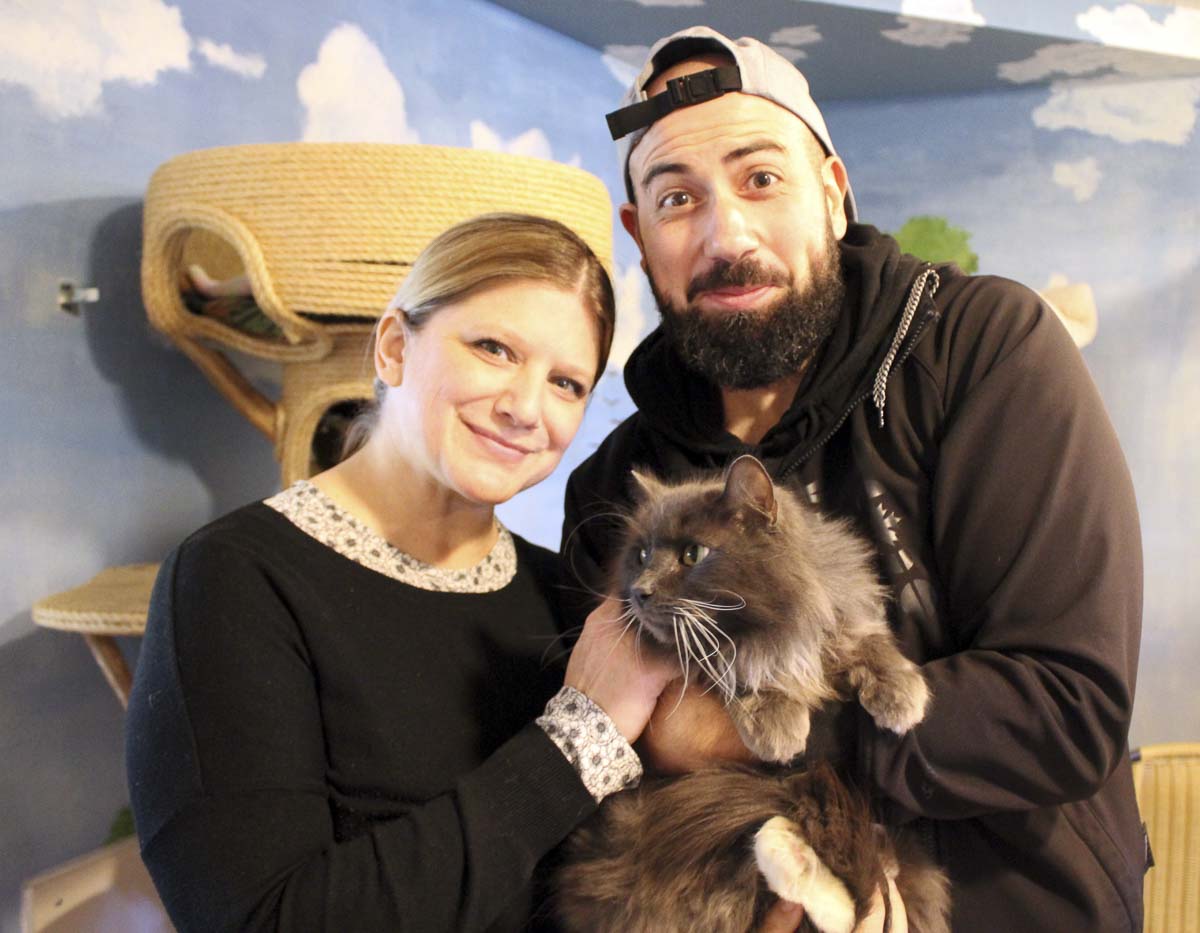 Jenn and Mike Morris are shown here with their Furry Friend. Photo courtesy of Furry Friends