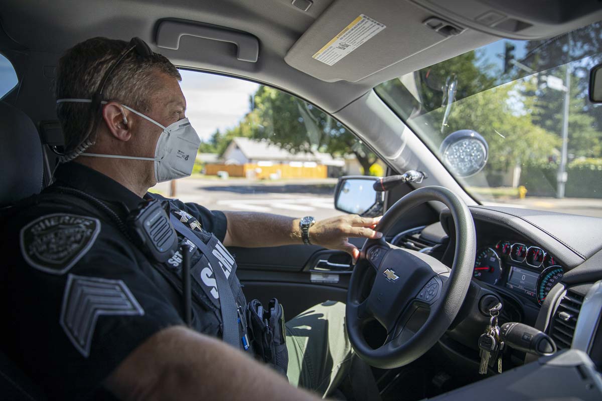 Clark County Sheriff’s Office Sgt. Alex Schoening in his patrol vehicle during the Target Zero motorcycle awareness campaign this month. Photo by Jacob Granneman