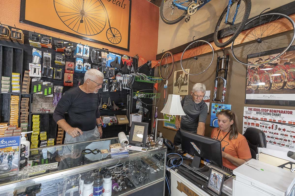Mike (left), Mark (center) and Wheels Deals employee Nicole Bertram (right) can be seen working together in the shop back in 2019. Photo by Mike Schultz