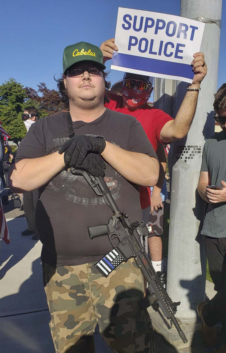 Jeremy of Washougal said he brought his AR-15 to the rally for self defense only. Photo by Paul Valencia