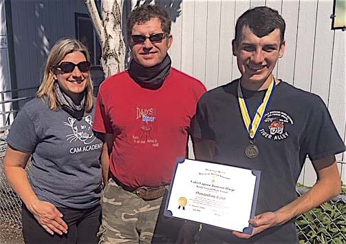 Battle Ground High School senior Jameson Harpe has been awarded the Sons of The American Revolution Bronze Medal and Certificate for his outstanding accomplishments while a member of the school’s Air Force JROTC program. Harpe (far right) is shown here with his parents Eric and Diane Harpe. Photo courtesy of Jeff Lightburn