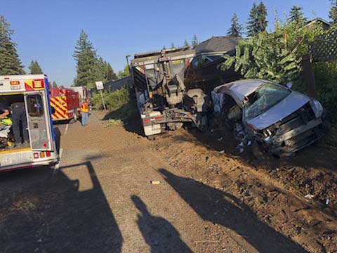 Drivers of a commercial dump truck and a car involved in a Monday morning collision in Vancouver each sustained non-life threatening injuries and were transported to PeaceHealth Southwest Medical Center for treatment. Photo courtesy of Joe Hudson/Vancouver Fire Department