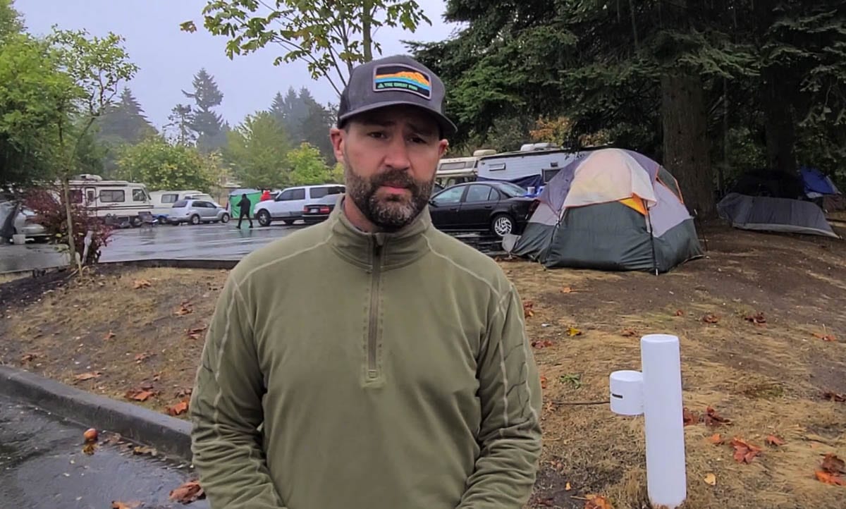 Bart Hansen, a member of the Vancouver City Council, toured the Leverich Park area on Wednesday to get a look at the homeless camps at a parking lot and on nearby trails. Photo by Paul Valencia
