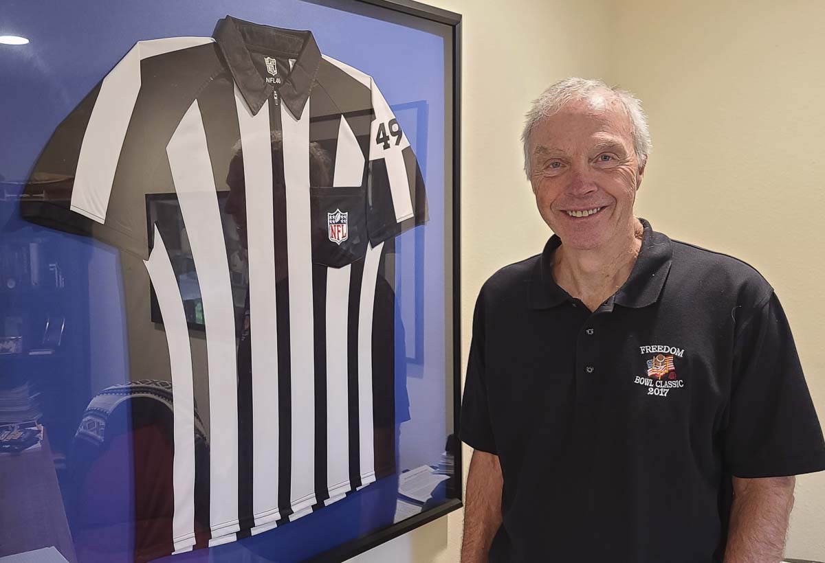 Bruce Hermansen, the president of the Evergreen Football Officials Association, is proud of his seven weeks working as a referee in the National Football League back in 2012. Photo by Paul Valencia