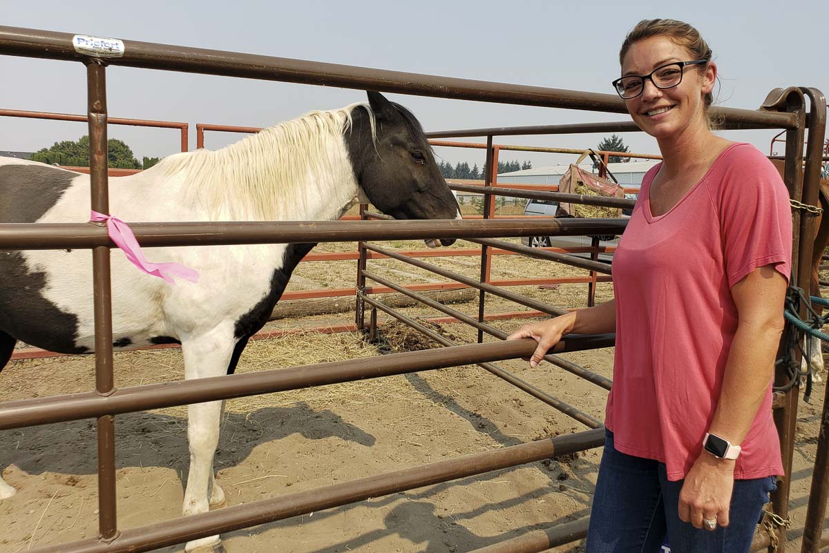 Haley Minsker of the Clark County Saddle Club was one of the organizers who put out a call for help, and the help responded. Members turned the club into a place for more than 100 horses to stay temporarily. Photo by Paul Valencia