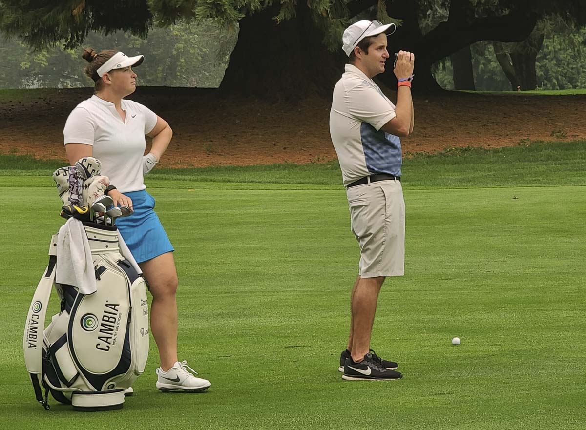 Caroline Inglis waits for her caddy (and husband) Taylor Klopp to find the right yardage during a practice round Thursday for the Cambia Portland Classic. Photo by Paul Valencia