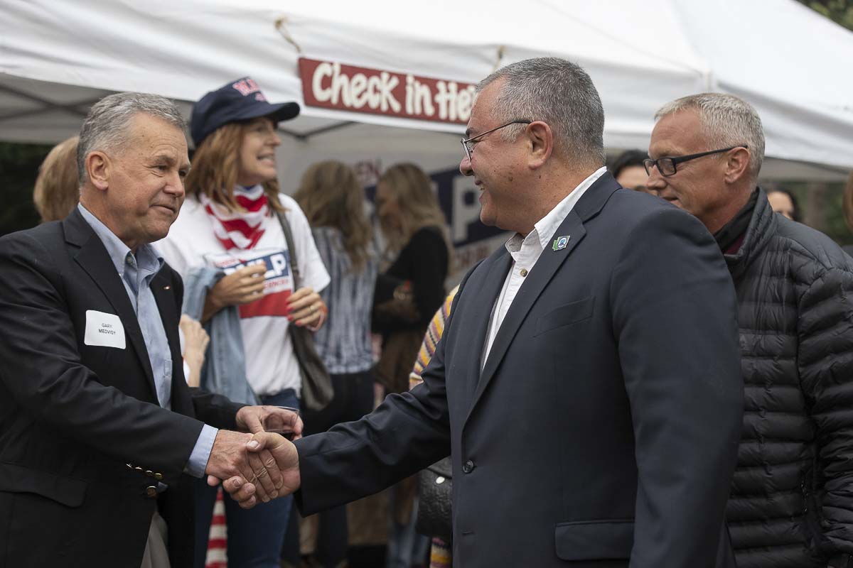 Clark County Councilor Gary Medvigy (left) and Washington Republican gubernatorial candidate Loren Culp (right) shake hands at a campaign event in Camas on Sept. 16. Photo by Mike Schultz
