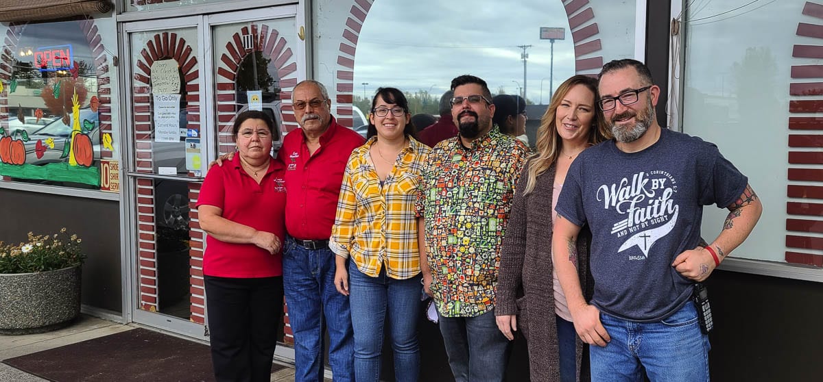 Justin and Ann McClintock (right), owners of Five-Star Tattoo in Battle Ground, raised funds for its neighboring business, Las Mesitas Restaurant after the restaurant suffered a setback. The restaurant is owned by the Ramos family, Nacha and Vicente, with help from their children Gabriela and Guadalupe. Photo by Paul Valencia