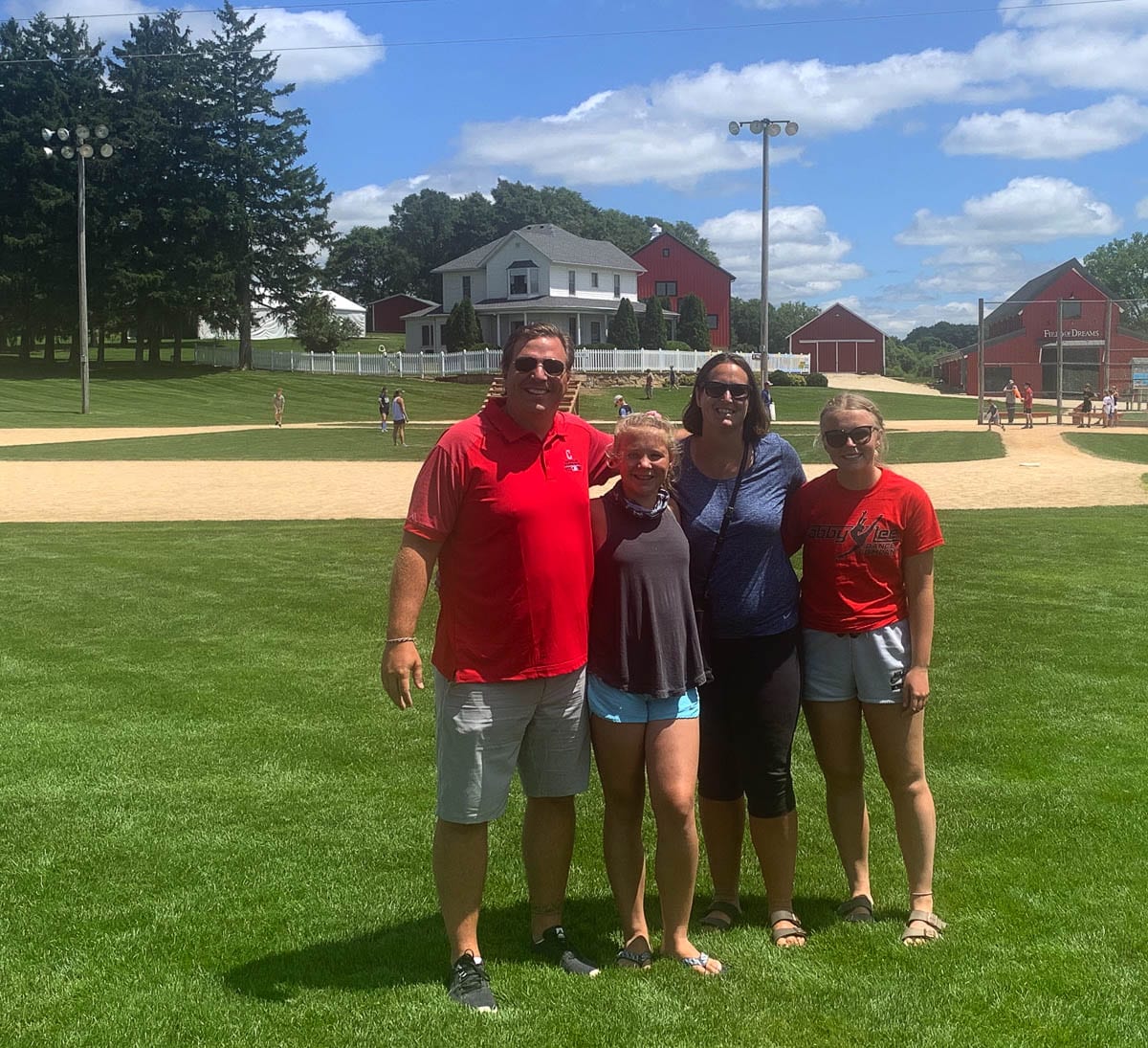 Is this heaven? No, it’s the Castro family in Iowa. The Castros, movie buffs and historians, traveled the country to seek out locales of famous movies such as this baseball field in Iowa, home of Field of Dreams. Photo courtesy of the Castro family