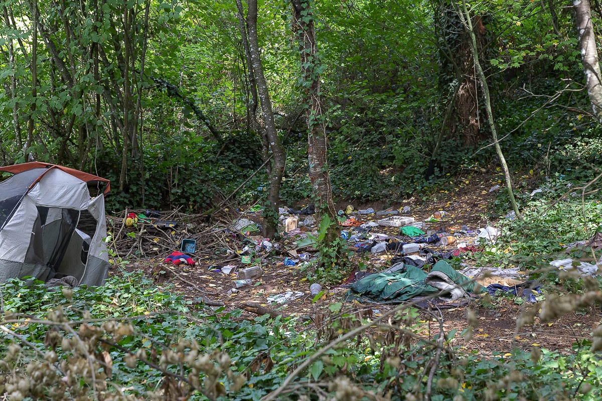 A garbage dump at an abandoned tent site is just a few feet off of the Ellen Davis Trail near Leverich Park. Photo by Mike Schultz