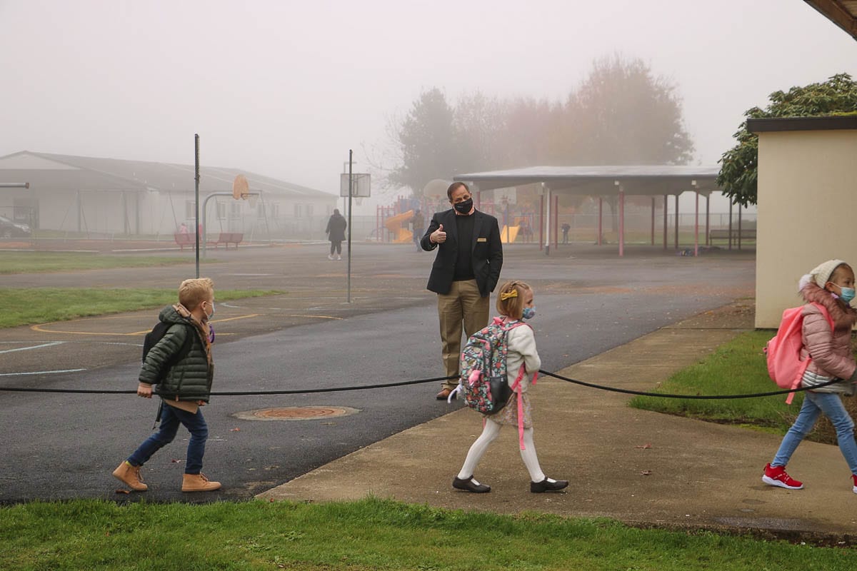 Battle Ground Public Schools Superintendent Mark Ross greets kindergarten students returning to class Monday at Glenwood Heights Primary School. Photo courtesy Battle Ground Public Schools