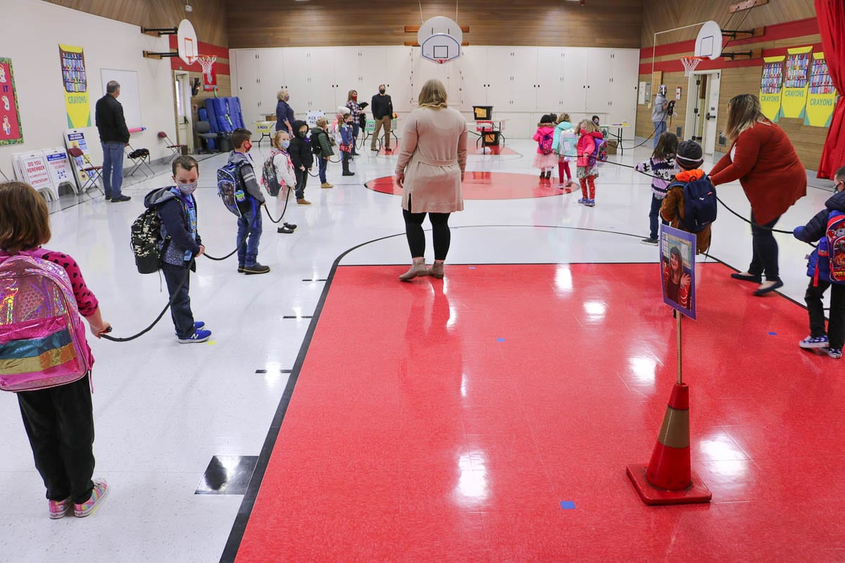 Kindergarten students line up in the gym before starting the school day Monday to have their temperatures checked. Photo courtesy Battle Ground Public Schools