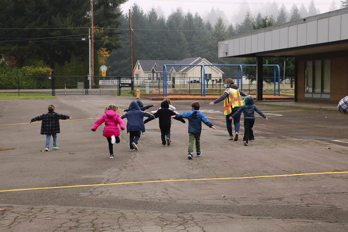 Kindergarten students are guided through the playground area at Glenwood Heights Primary School on Nov. 9. Photo courtesy Battle Ground Public Schools