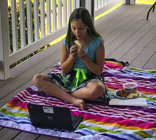 South Ridge Elementary School fourth grader Sidney Krause enjoys lunch while connecting remotely via Zoom with her classmates and teacher Karen Moses during a recent Friendship Fiesta lunch on Oct. 2. Photo courtesy of Ridgefield Public Schools
