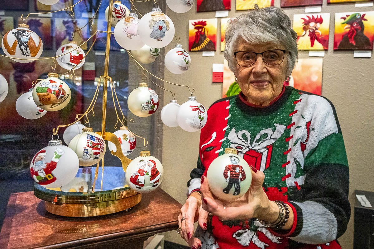 A display in the Camas Gallery shows off the variety of Covid-themed Christmas ornaments created by Bev Birdwell. Photo by Mike Schultz