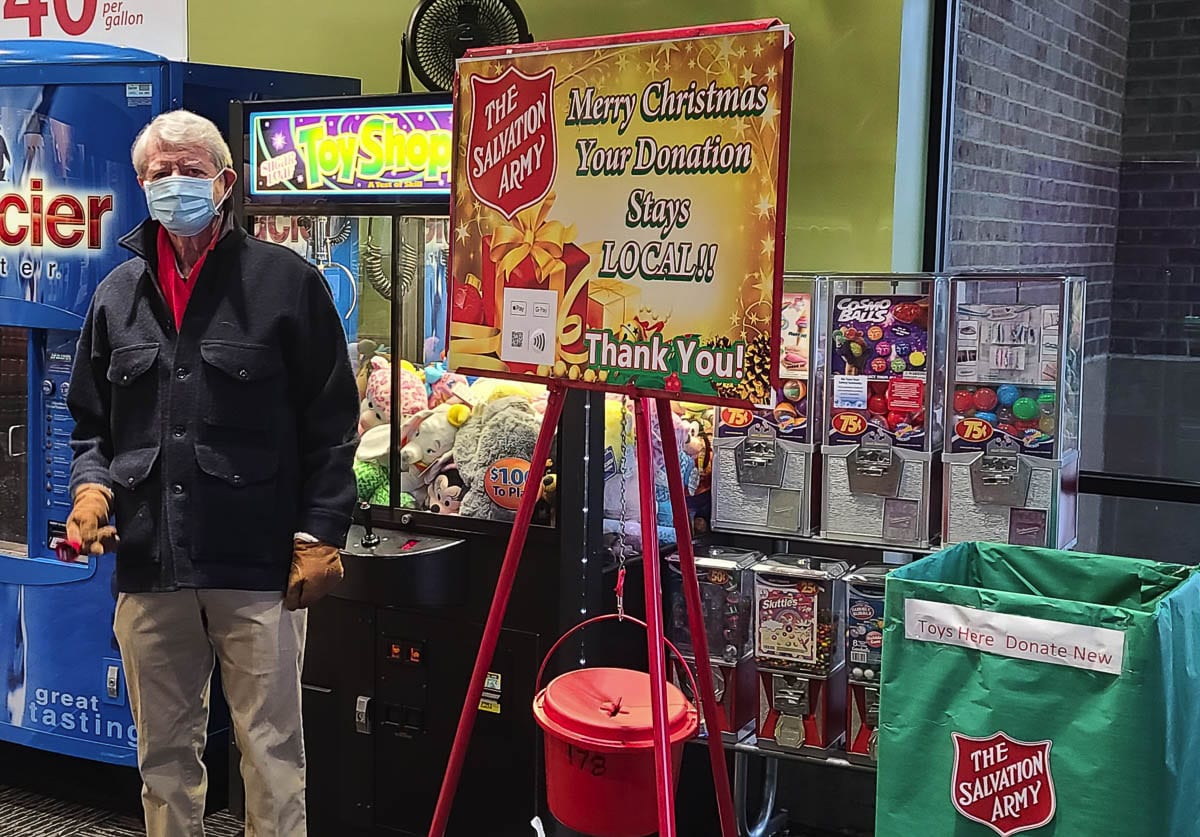 Chuck Mulligan, a retiree from Vancouver, rings the bell for the Salvation Army on Friday. This is his 58th consecutive year as a volunteer for the program. Photo by Paul Valencia
