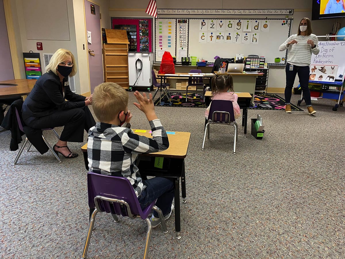 Washougal Schools Superintendent Mary Templeton observes a classroom where children are socially distanced. Photo courtesy of Washougal School District