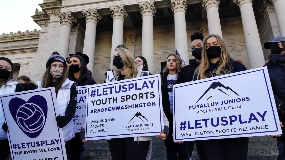 This girls volleyball team joined the Reopen Washington rally hoping to get indoor sports to be permitted. Photo by John Ley