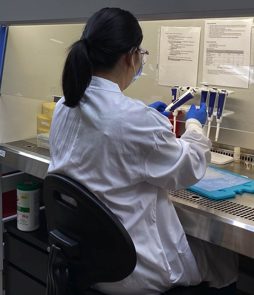 Diep Bui is prepping her workstation to begin testing. Each employee is able to result out up to 282 COVID-19 tests per day. Photo courtesy The Vancouver Clinic