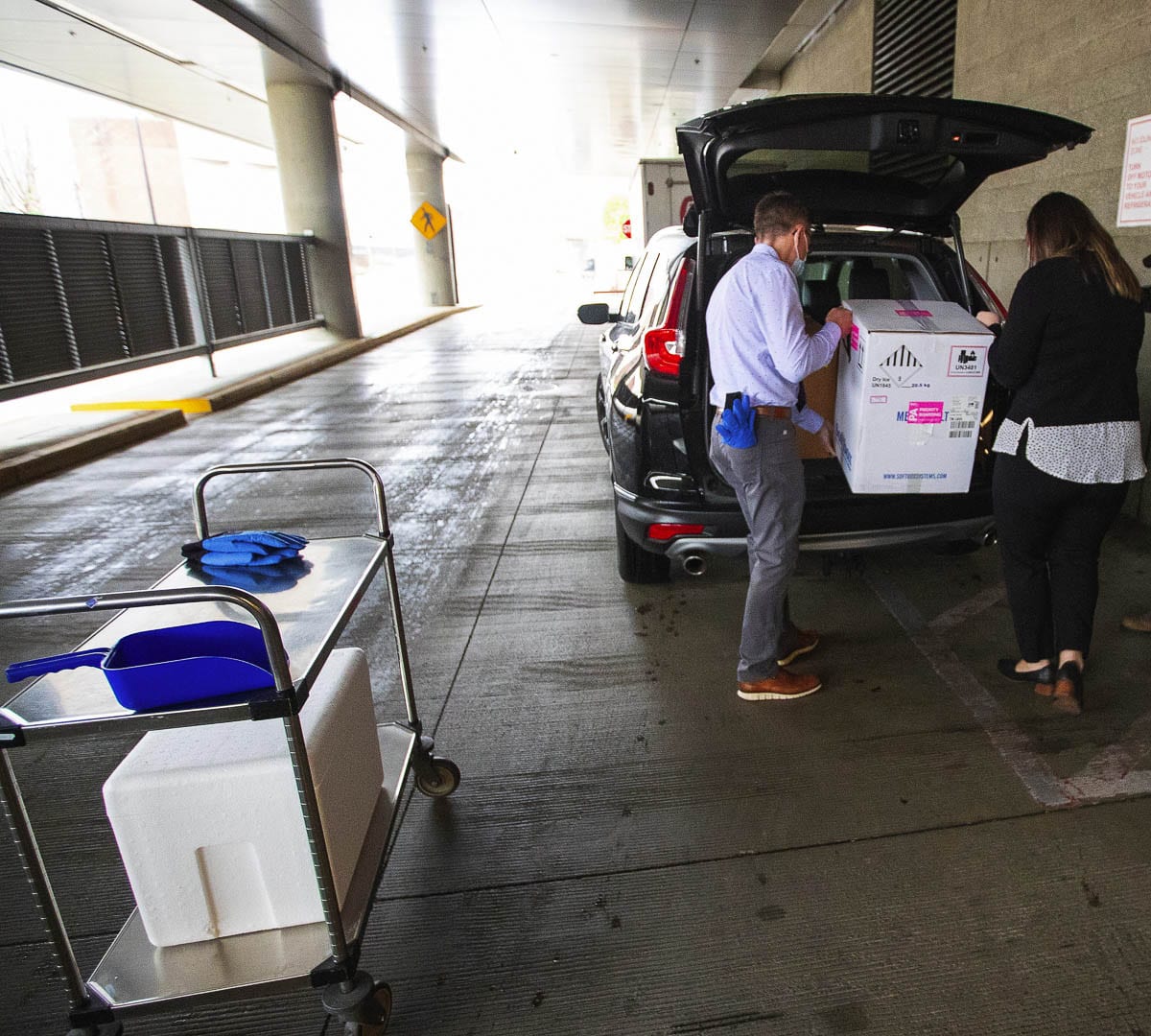 Shipments of Pfizer’s COVID-19 vaccine are kept in dry ice and carefully transported from the University of Washington Medical Center. Photo courtesy The Seattle Times