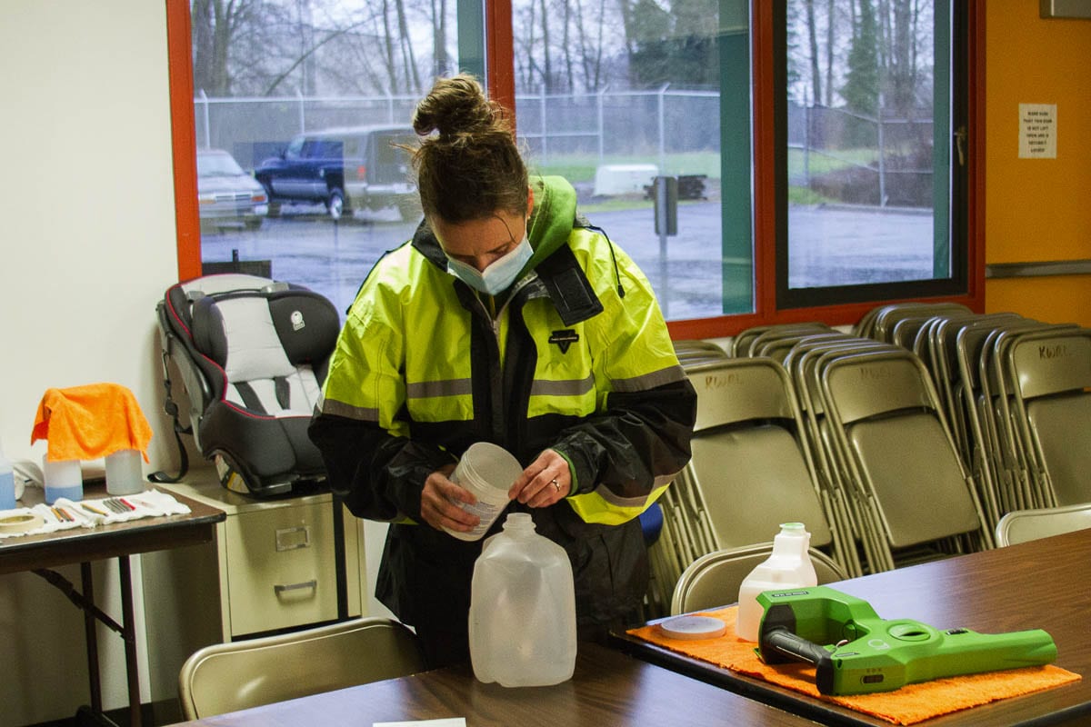 Mary Martin mixes the cleaning solution used in the electrostatic sprayers and prepares disinfecting supplies. Photo courtesy of Woodland Public Schools