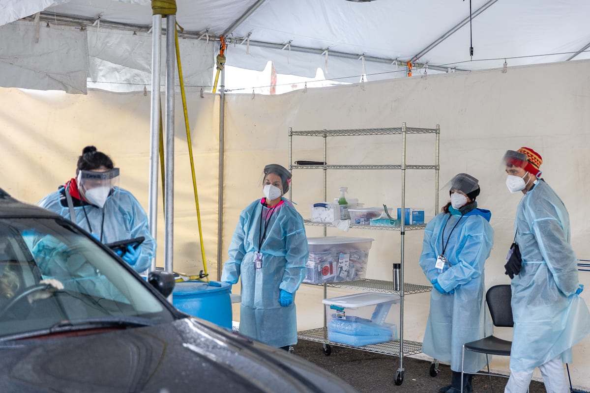 Test observers work to collect COVID-19 test samples at a free no-barrier clinic launching Tuesday at the Tower Mall site. Photo by Mike Schultz