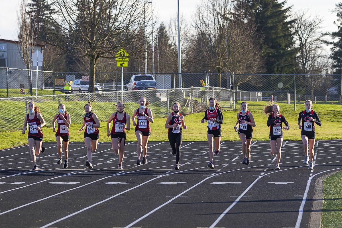 Camas and Union runners take off at the start of their race Wednesday at Camas High School. Cross country is one of the three sports that started competing this week, in the return of high school sports. Photo by Mike Schultz