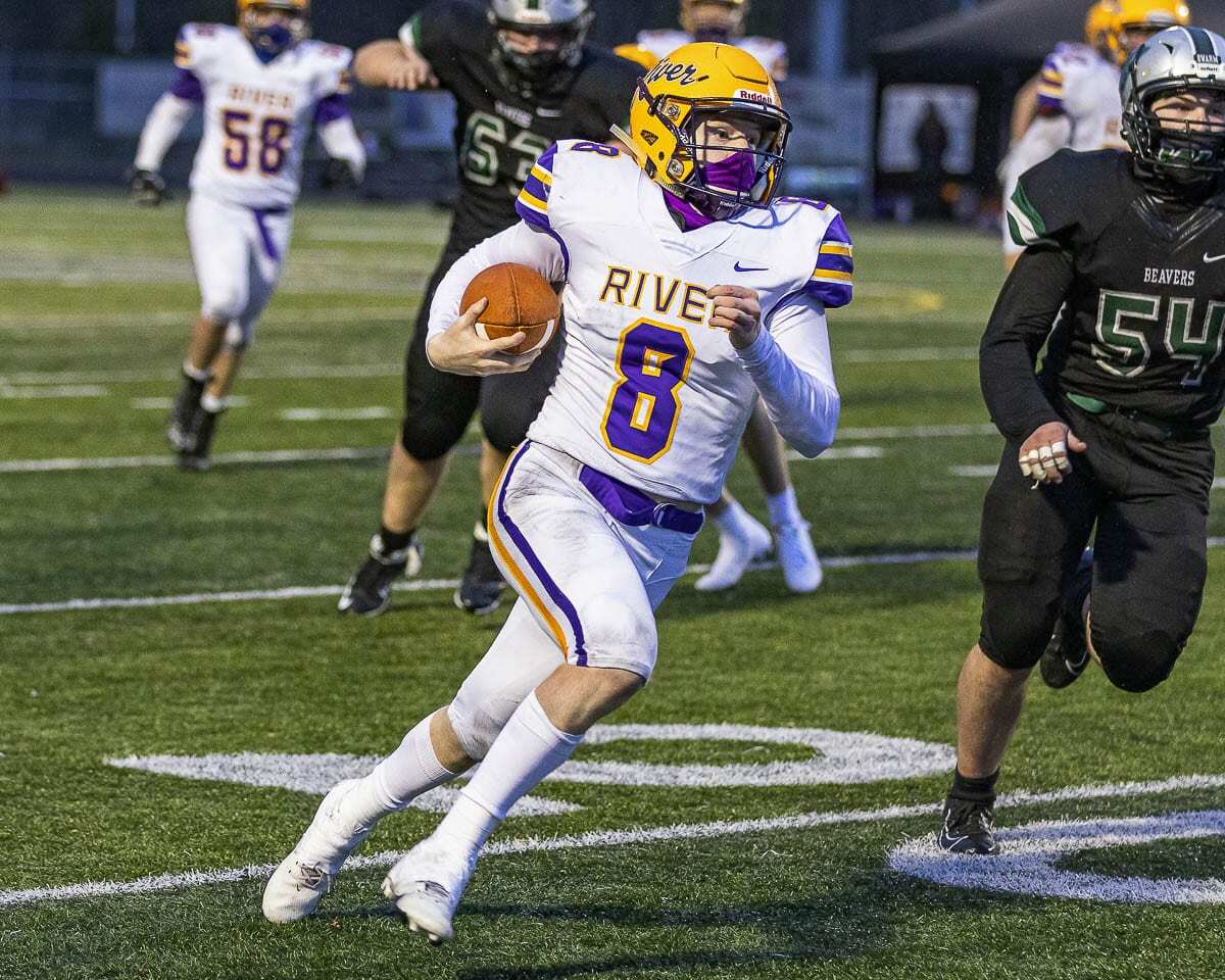 Columbia River quarterback Mason Priddy threw a touchdown pass and rushed for one in River’s 22-13 win over Woodland on Saturday. Photo by Mike Schultz