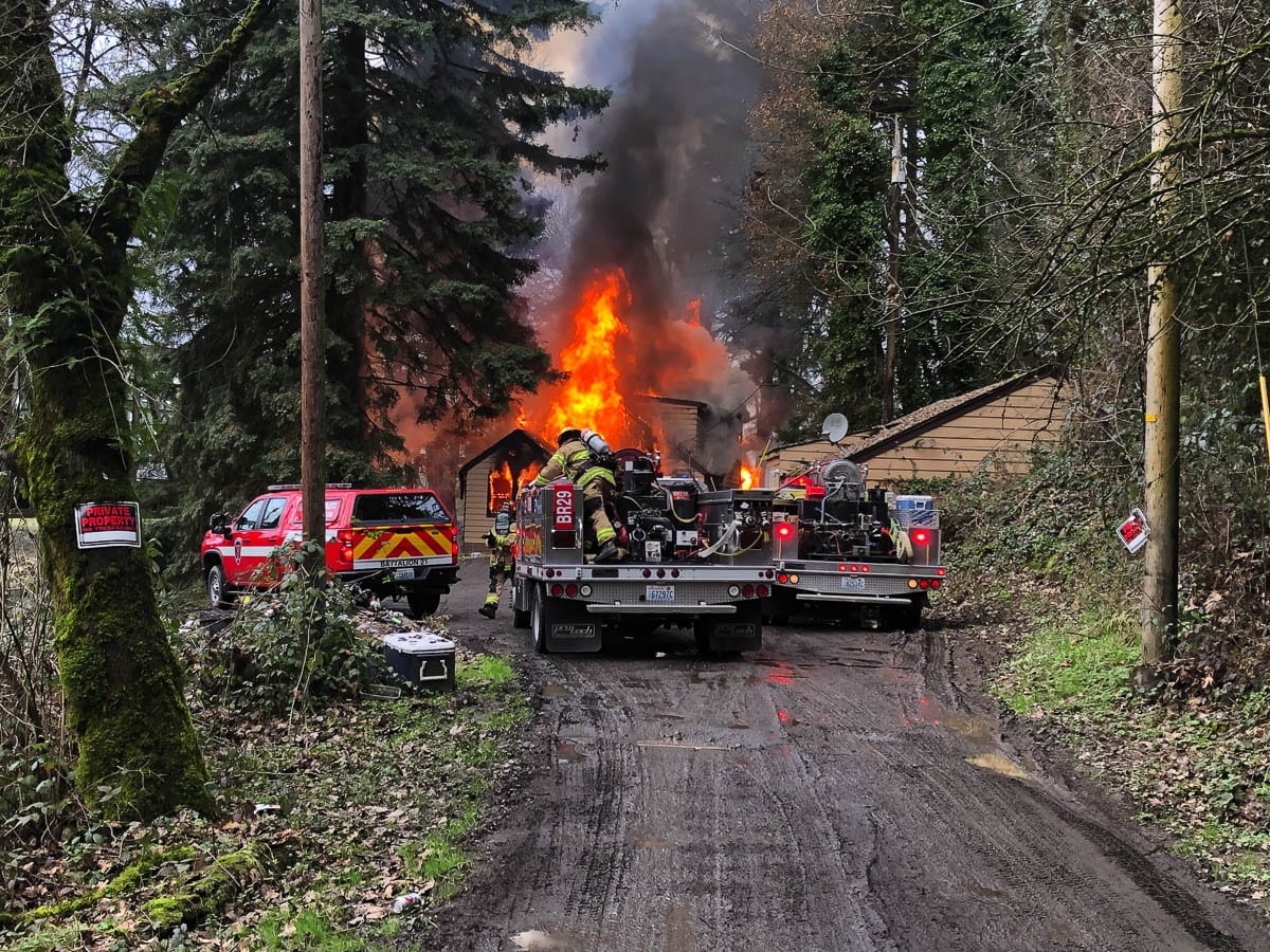 Crews from Clark-Cowlitz Fire Rescue faced significant access challenges to battle a blaze at a residence near Woodland Monday afternoon. Photo courtesy Clark-Cowlitz Fire Rescue