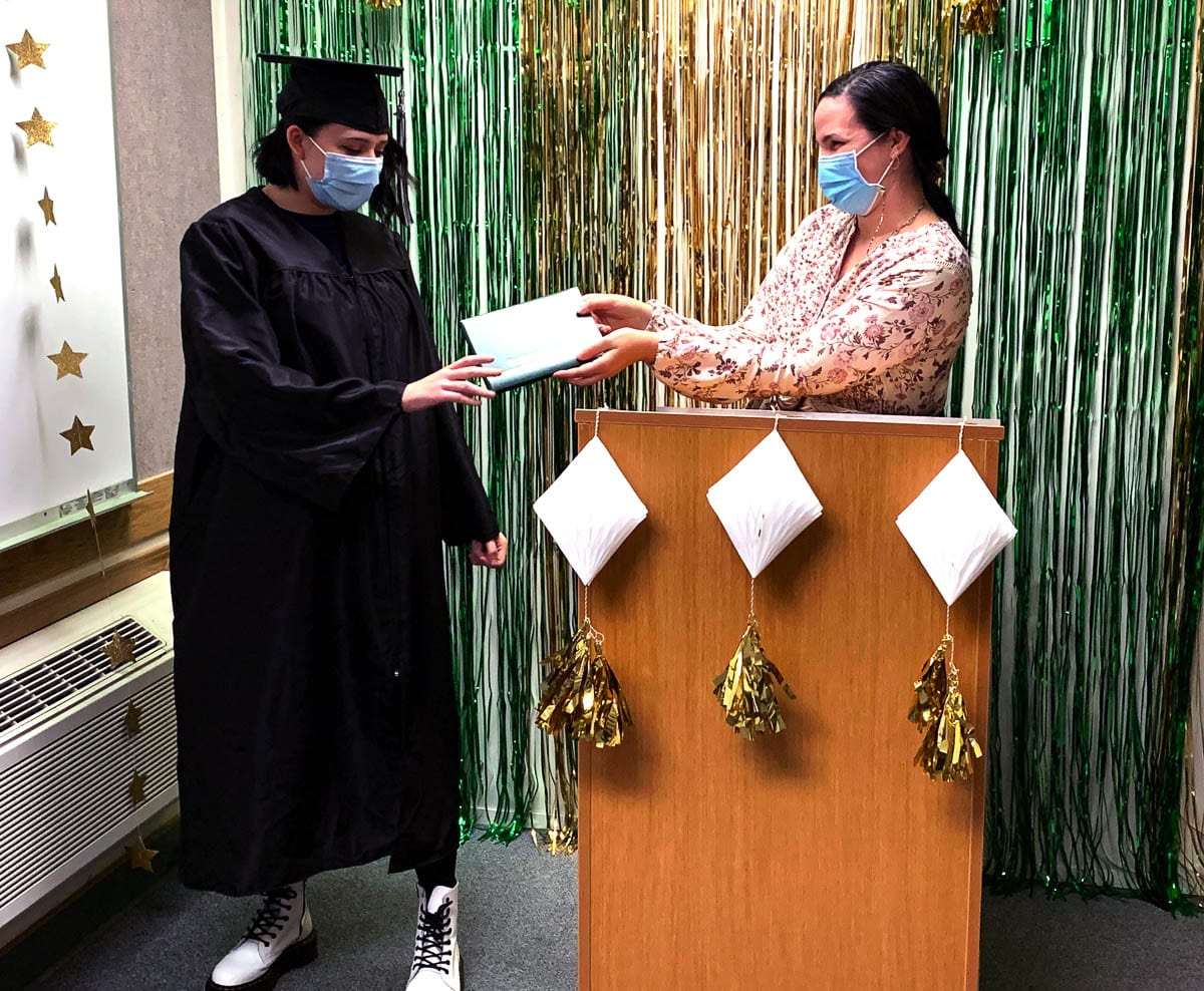 TEAM’s staff, including Math and Science teacher Elizabeth Vallaire, kept the ceremony small to maintain social distancing restrictions and required all attendees to wear masks throughout the commencement. Photo courtesy of Woodland School District