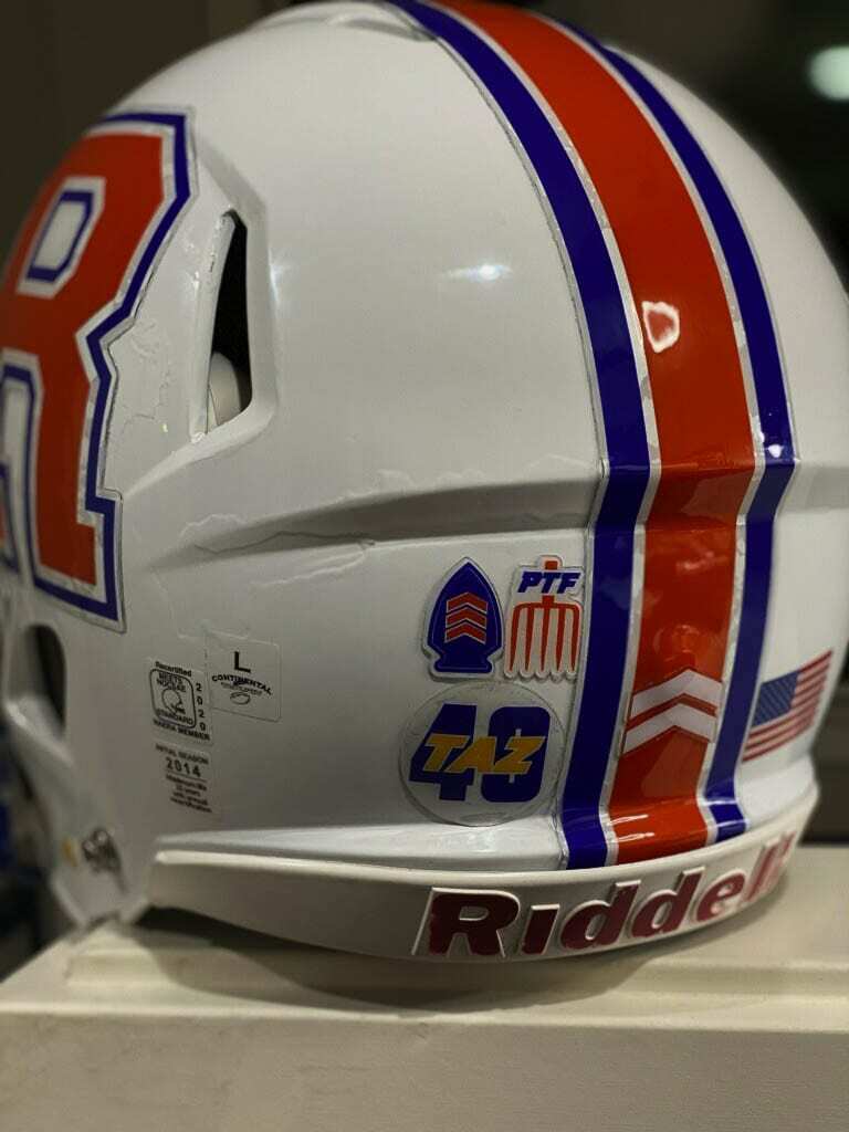 A closer look at the Ridgefield helmet with the “Taz 40” decal. Other teams will be wearing the decal as well, a tribute to a man who loved football and the values the game teaches. Photo courtesy Scott Rice