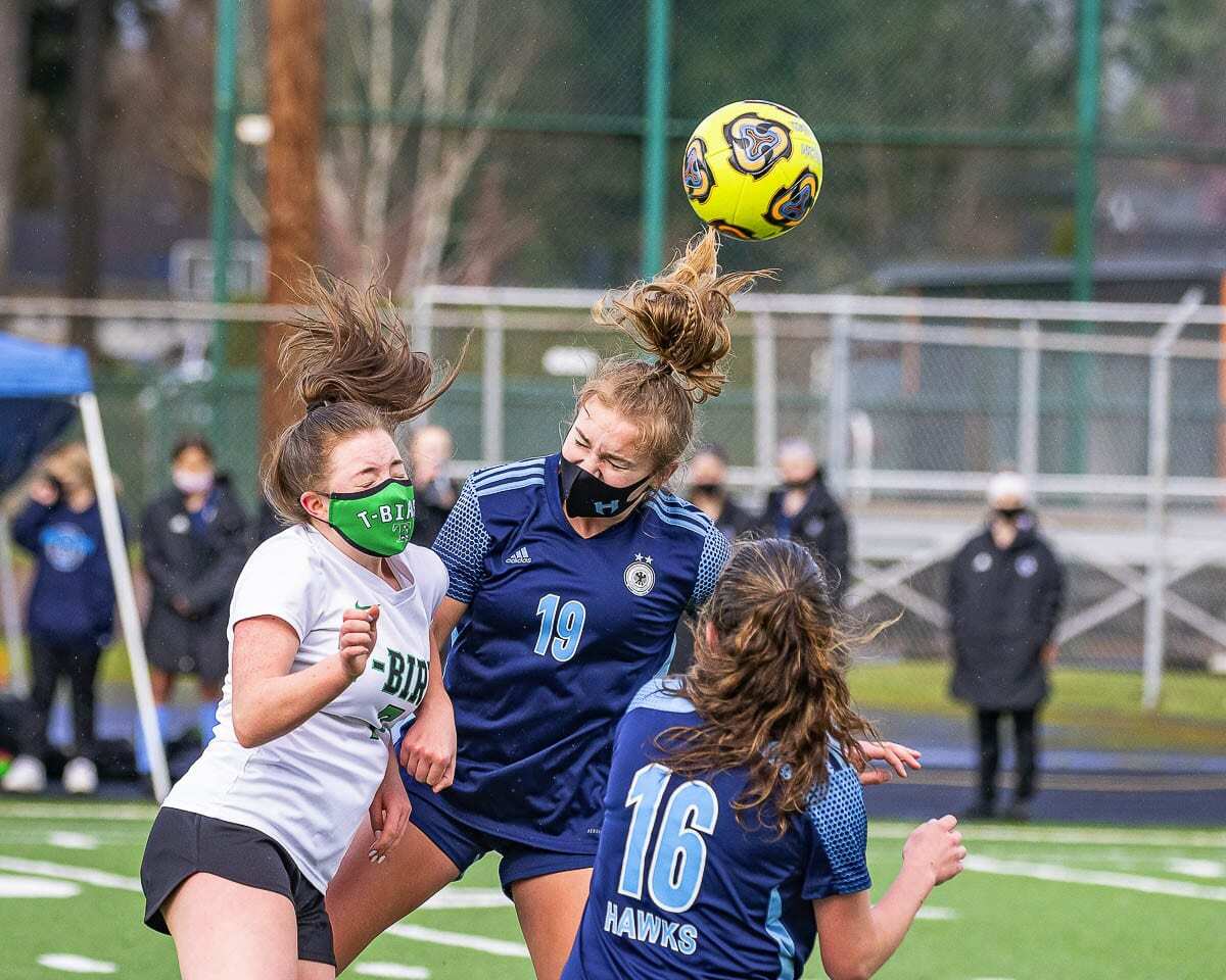 Payton Lawson (19) of Hockinson gets some air during her team’s soccer match against Tumwater on Saturday. Lawson scored two goals in a 2-0 win to claim the district championship. Photo by Mike Schultz