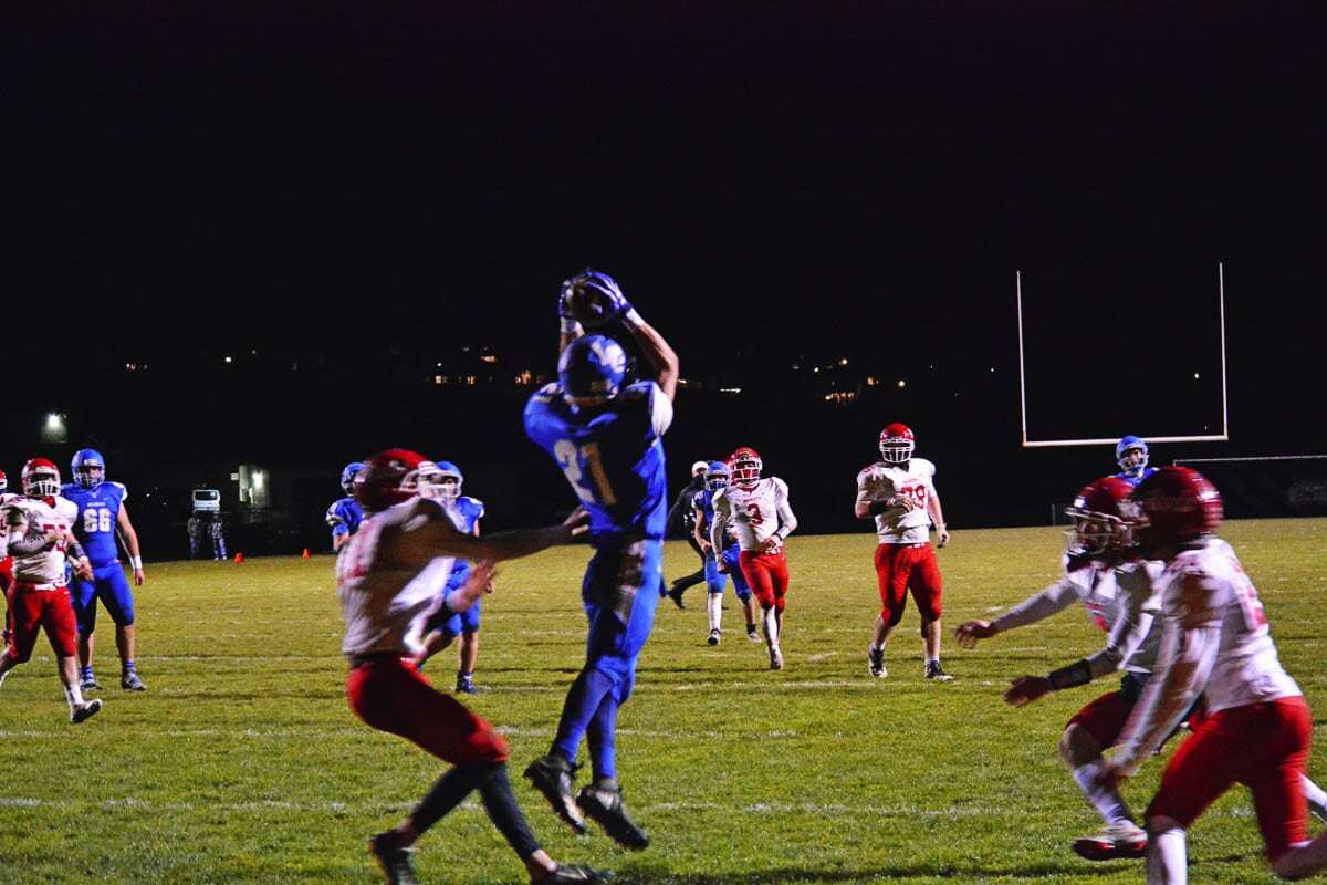 All the Castle Rock defenders can do is watch as Irving Alvarez makes an acrobatic move in the end zone for La Center. Photo by Dan Trujillo