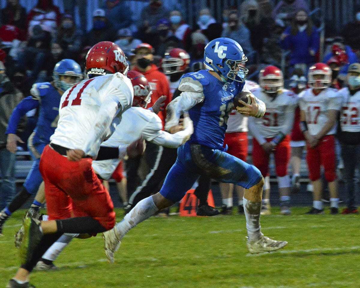 Micah Adams eludes a few Rockets on his way across the goal line for La Center. He also blocked a punt on defense. Photo by Dan Trujillo