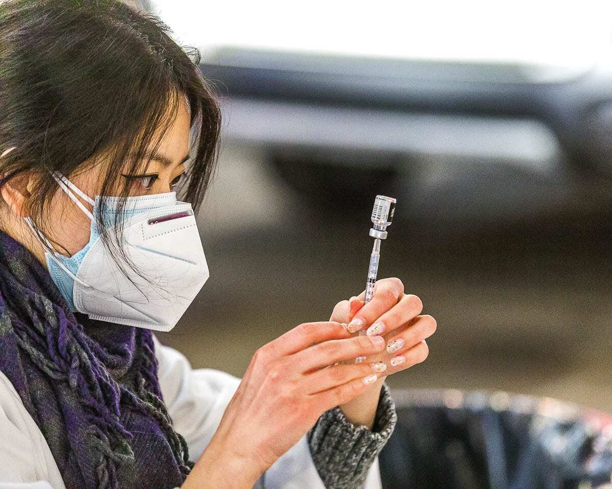 Safeway pharmacist Jennifer Park draws a vaccine dose at the Clark County Fairgrounds vaccination site. Photo by Mike Schultz