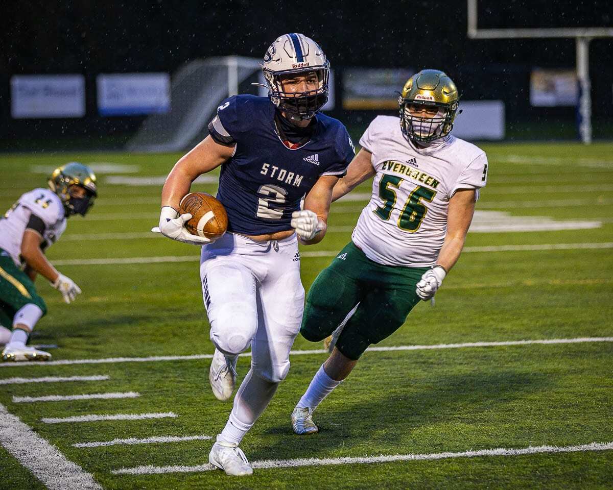 Rhett Sarvela races down the sideline in this photo. Later, he would grab a one-handed touchdown pass for the Skyview Storm. Photo by Mike Schultz