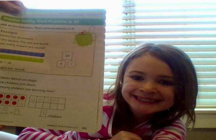 Teagan Devlin is proud to show off her math homework to the Zoom camera. Photo courtesy of Ridgefield School District
