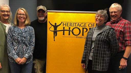 The HOH board from left to right: Bev Alley, Lisa Clear, Scott Stuart, Melody and Dan Miller, and Dave Williams (not pictured). Photo courtesy of Heritage of Hope