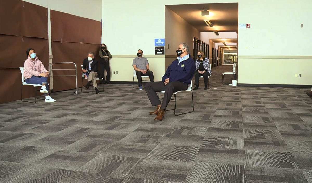 Washington Gov. Jay Inslee meets with elected officials and BIPOC community leaders during a visit to the Tower Mall vaccination and COVID testing site on Friday. Photo via KOIN-TV Live Stream