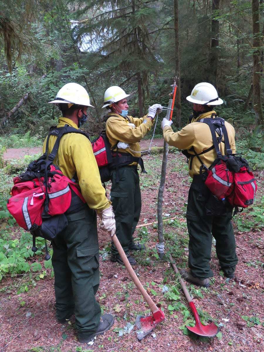 Wildland firefighters with the United States Forest Service are seen here protecting structures inside the wildland-urban interface during the fire season of 2020. Photo courtesy of USFS