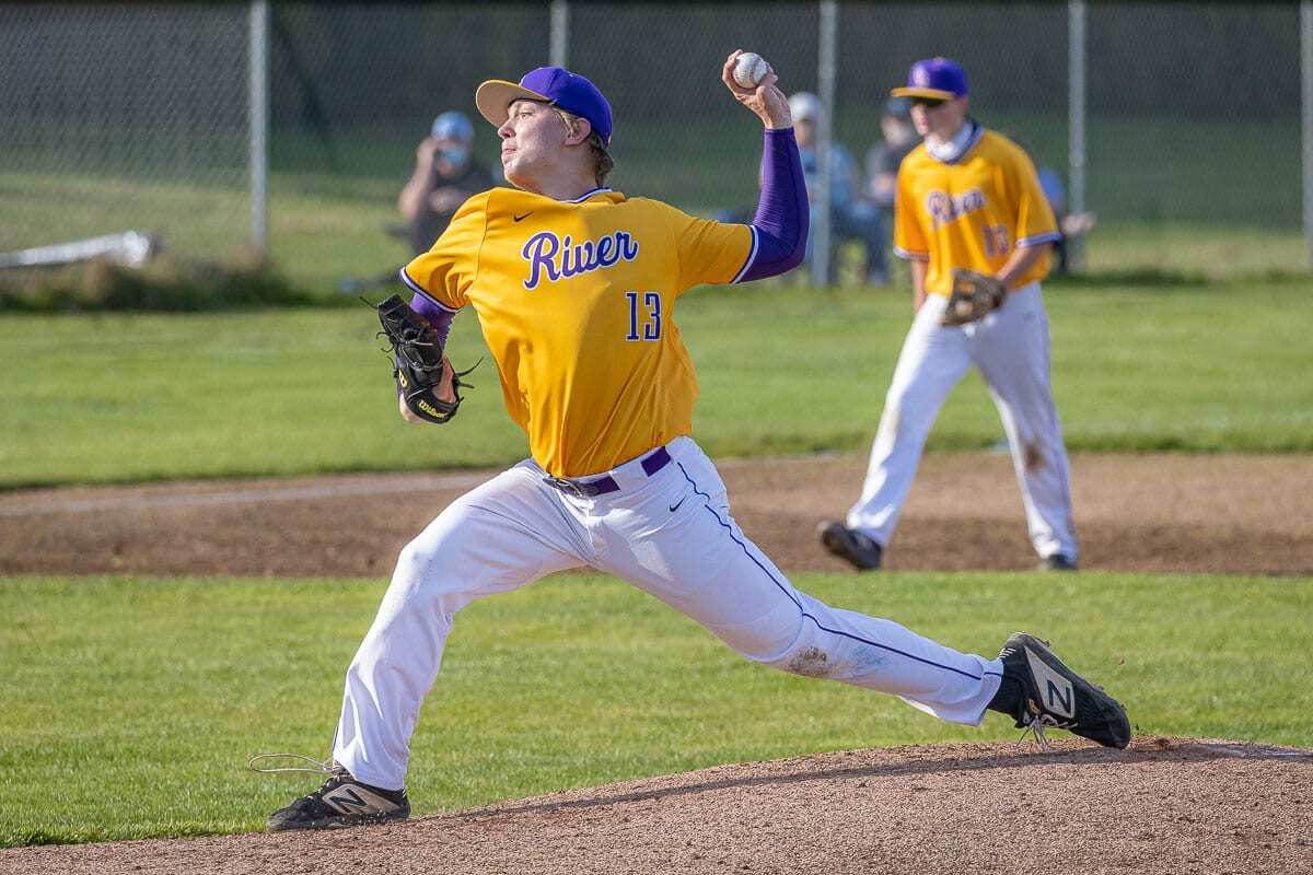 Sam Boyle of Columbia River delivers a pitch Wednesday. The Class 2A and 1A schools have already started spring sports, while the 4A and 3A schools are still finishing fall sports. All part of pandemic scheduling. Photo by Mike Schultz