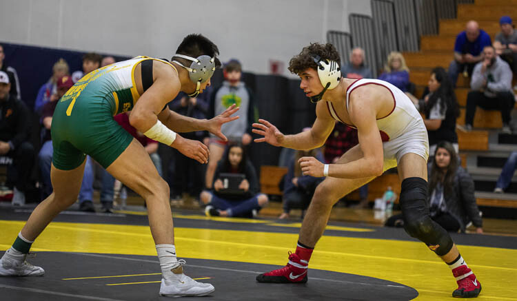 Prairie High School’s Jason Wilcox, right, shown here at the Clark County championships in 2020, said he is thrilled to have the opportunity to wrestle one final time for the Falcons. Prairie’s wrestling program had been shut down, but new rules regarding the pandemic means the team is planning on being able to compete next week. Photo by Jacob Granneman