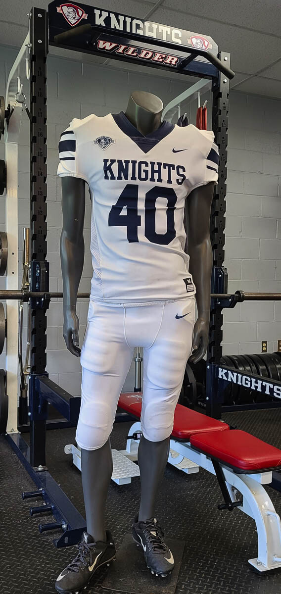 A King’s Way Christian football uniform is displayed on a mannequin at the school’s relatively new weight room. Varsity football is expected to return to the private high school this fall. Photo by Paul Valencia