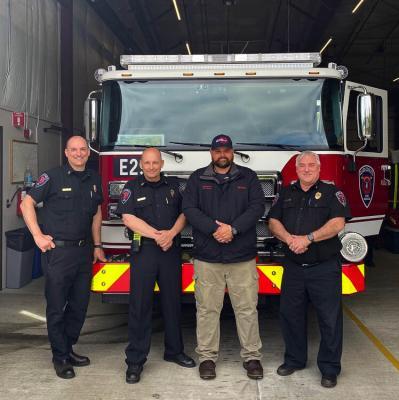 CCFR Division Chief Ben Peeler, Fire Chief John Norh, Fire Commissioner Stan Chunn and Division Chief Dan Yager are shown here in front of Engine 29. Photo courtesy of Clark-Cowlitz Fire Rescue