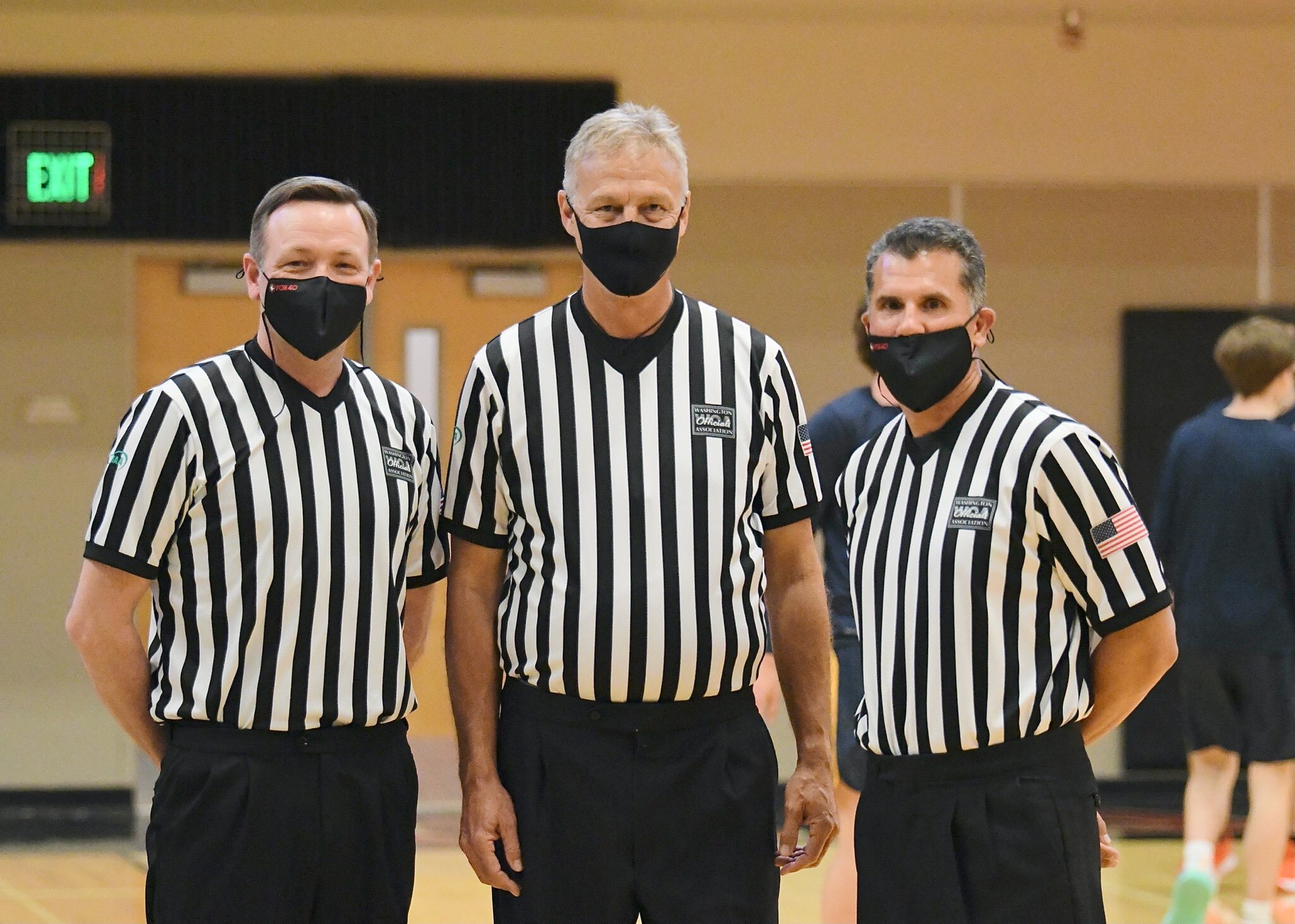 Heath Powell, Neil Anderson, and John Matteo prepare to officiate a basketball game in the pandemic. Anderson is a basketball and soccer official with decades of experience. There are fewer officials for high school sports these days. Photo courtesy Kris Cavin