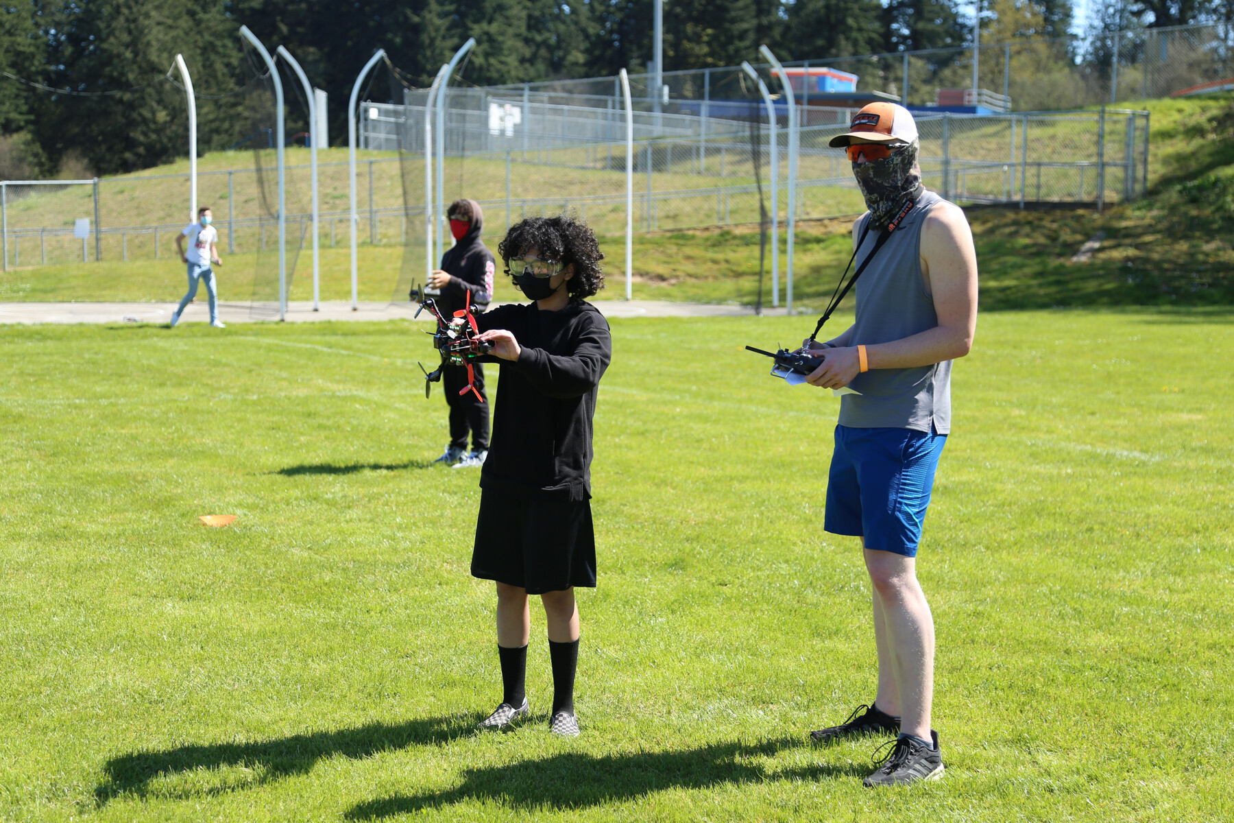 Ridgefield High School students Maya Ibanez-Gibson and Jonah Bernatz prepare to launch their drone for its first flight. Photo courtesy of Ridgefield School District