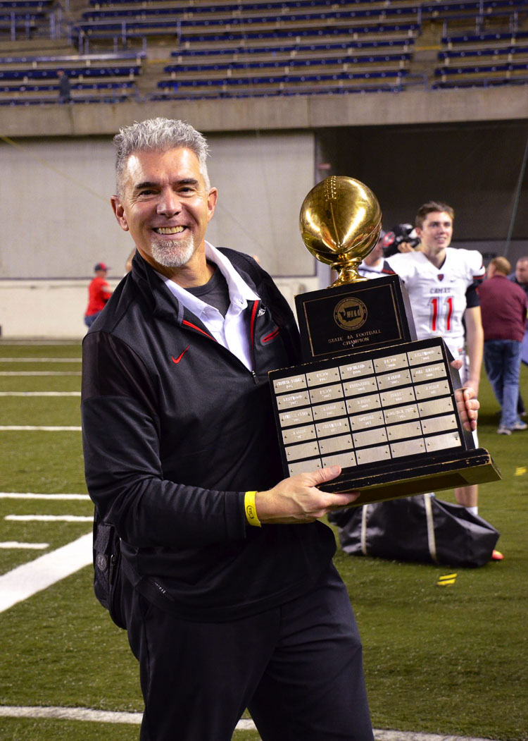 Jon Eagle is all smiles with the state championship trophy in 2016. Photo courtesy Kris Cavin